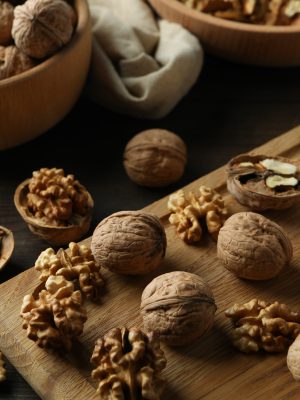 Concept of healthy food with walnuts on wooden background