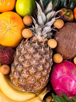 Tropical fruits background, many colorful ripe tropical fruits